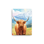 A Nicheink Highland Cow Canvas Wall Art | Rustic Farmhouse Decor standing in a field with mountains in the background.