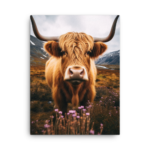 A Nicheink Highland Cow Canvas Wall Art - Rustic Farmhouse Decor is standing in a field with purple flowers.